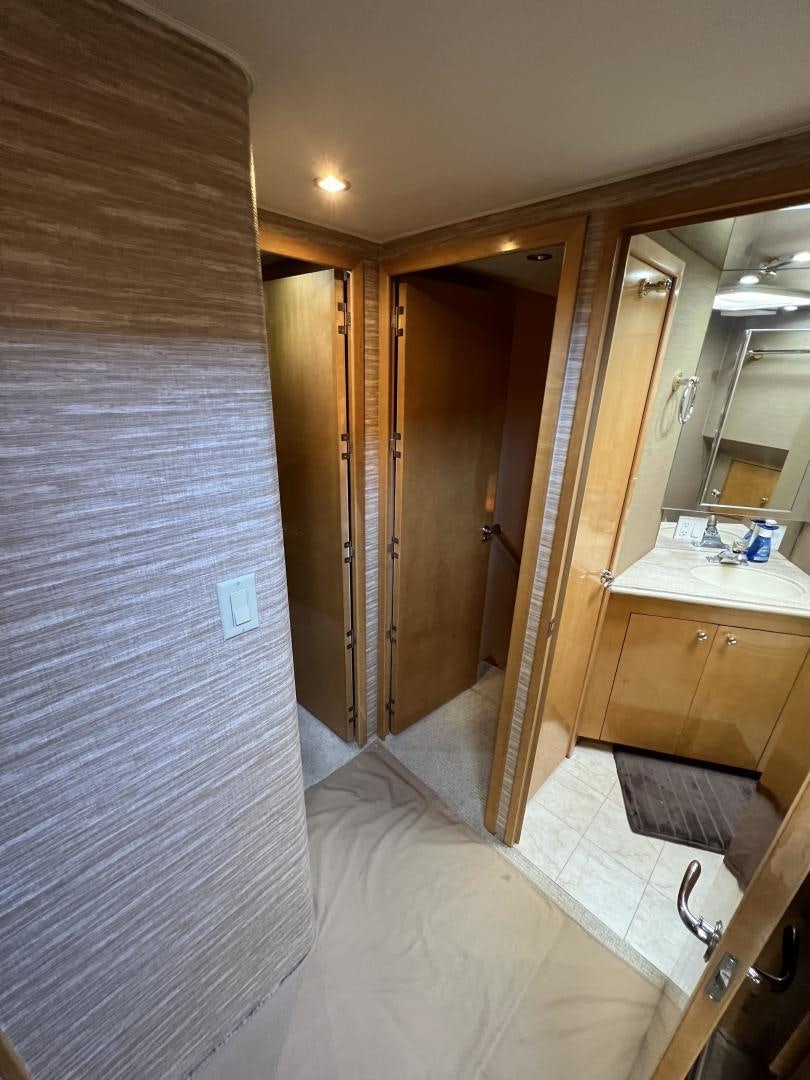 a bathroom with a shower and a sink aboard LUCKY JOE Yacht for Sale