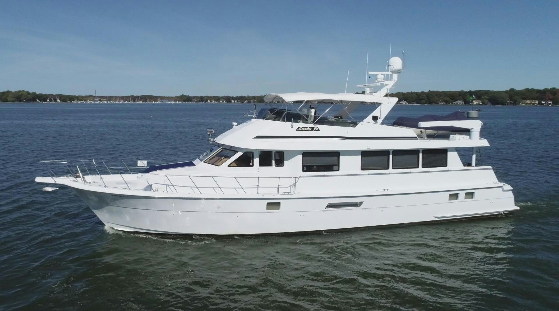 a white yacht on the water aboard LUCKY JOE Yacht for Sale