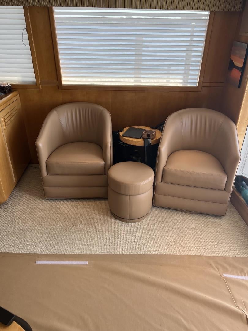 a room with a couch and a table and a window aboard LUCKY JOE Yacht for Sale