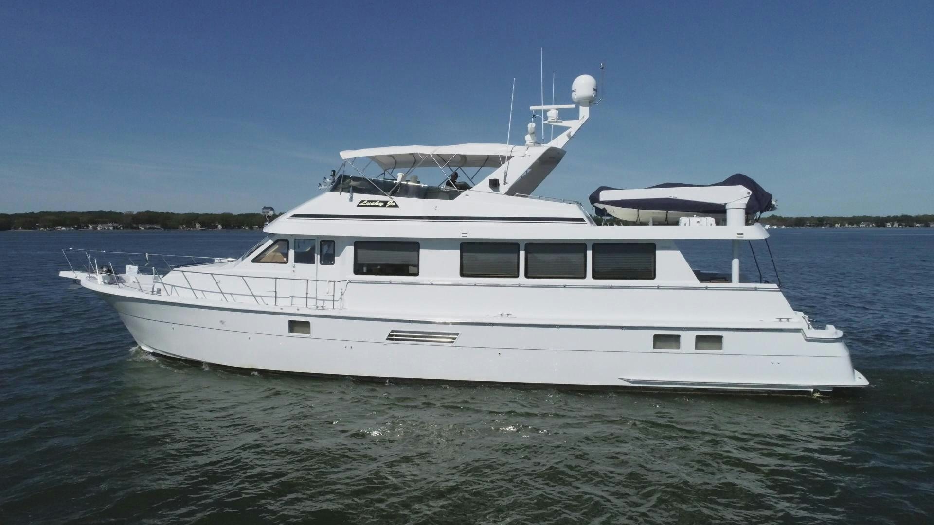 a white yacht in the water aboard LUCKY JOE Yacht for Sale