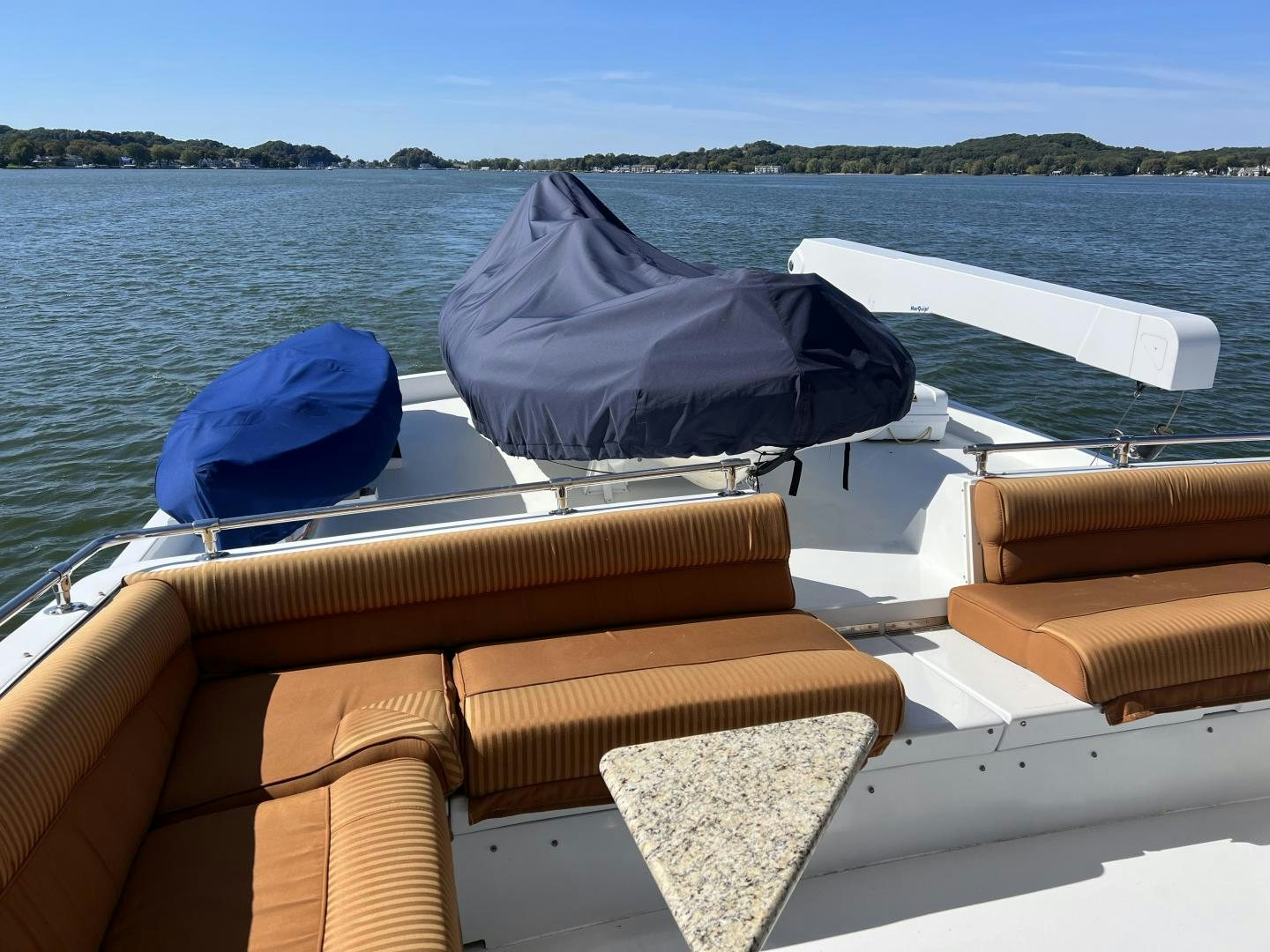 a boat with a blue cover on it aboard LUCKY JOE Yacht for Sale