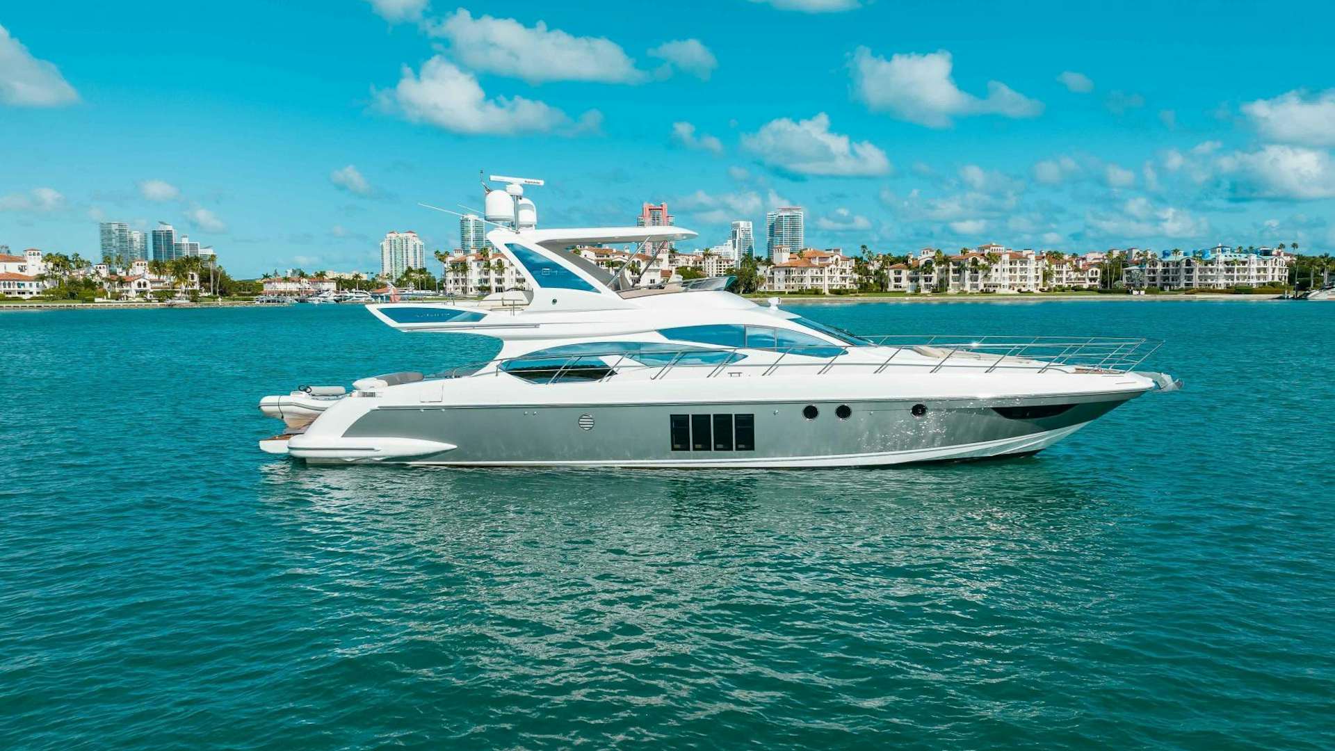 a white yacht in the water aboard BELLA VITA Yacht for Sale