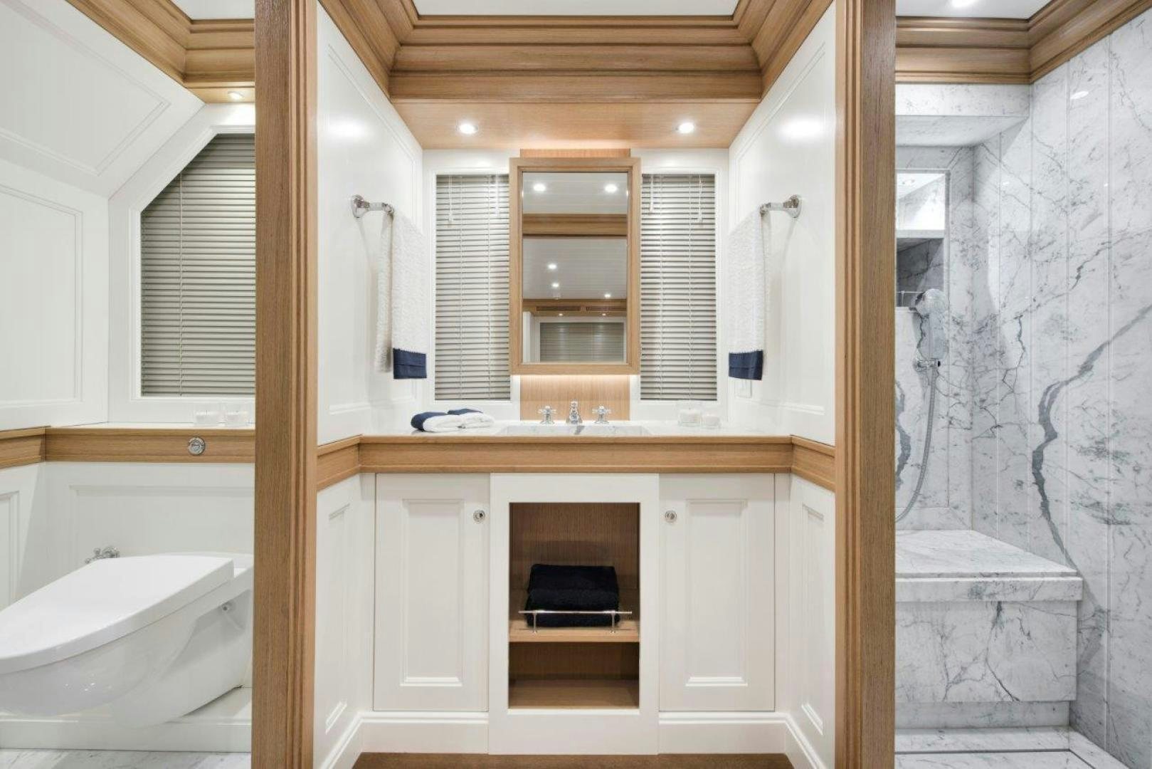 a bathroom with a sink and cabinets aboard MAGNOLIA ONE Yacht for Sale