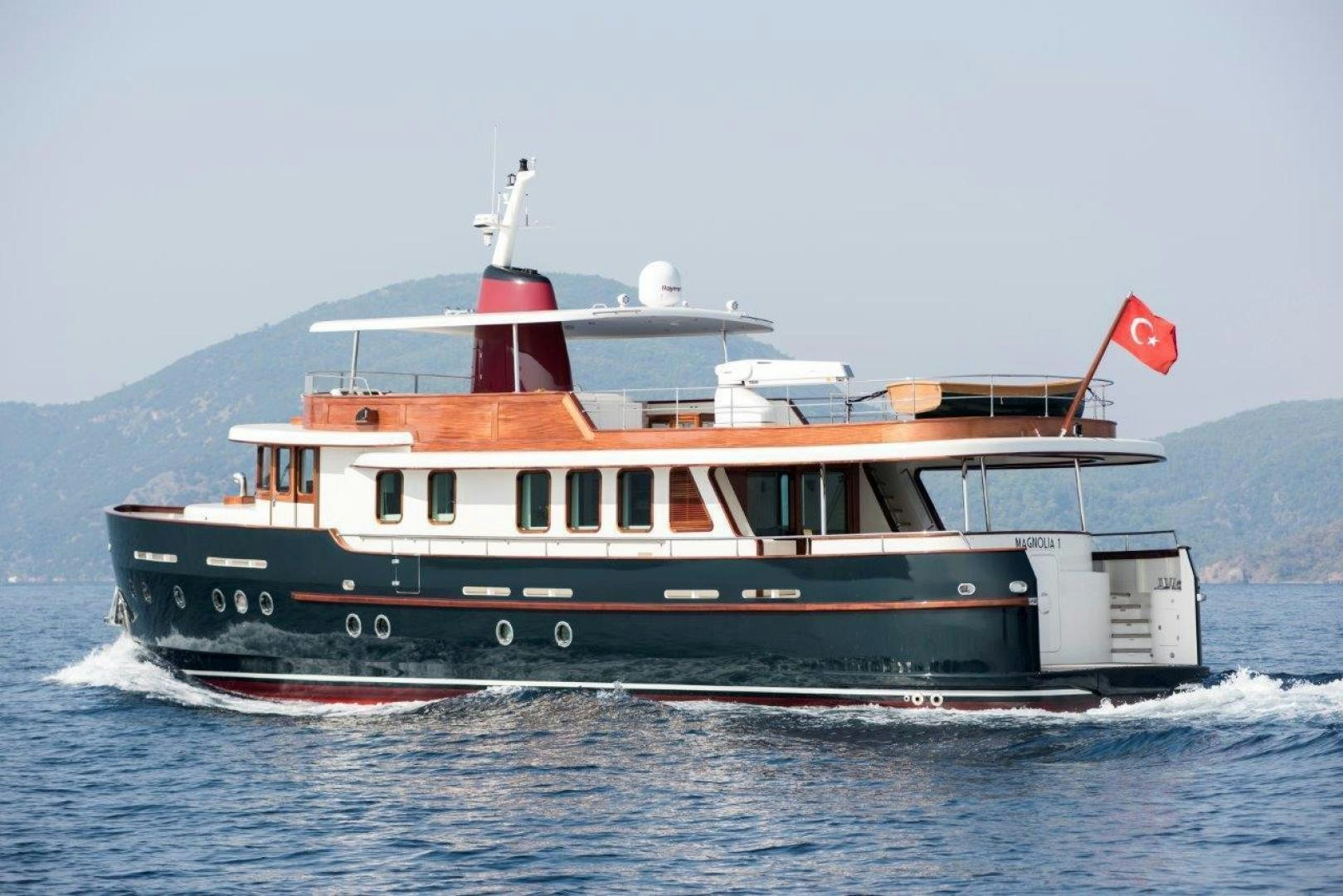 a large boat in the water aboard MAGNOLIA ONE Yacht for Sale