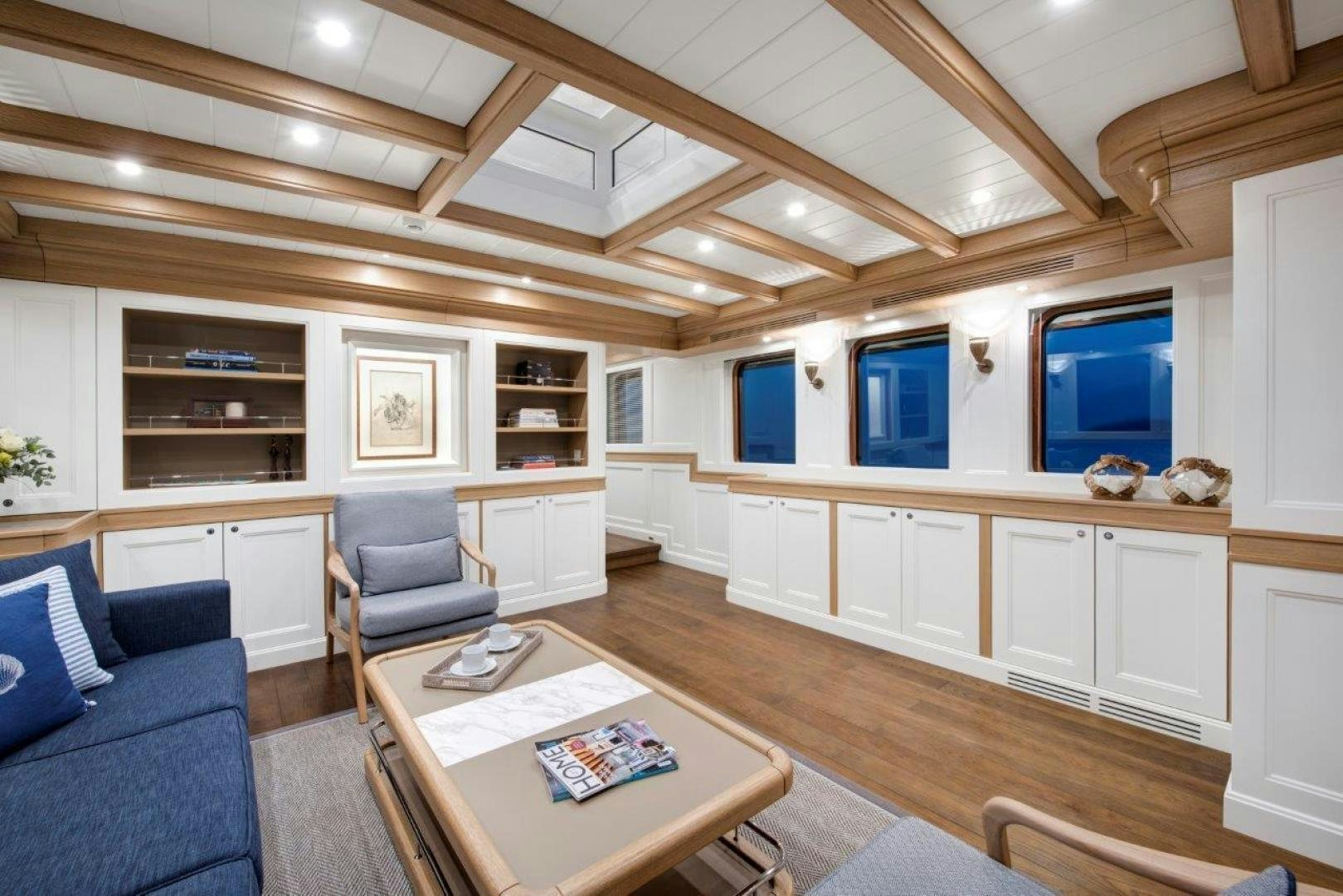 a living room with a large open ceiling aboard MAGNOLIA ONE Yacht for Sale