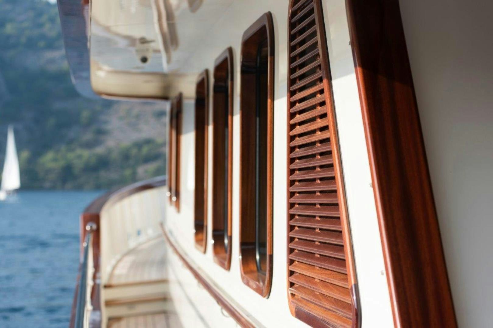 a boat with a wood deck aboard MAGNOLIA ONE Yacht for Sale