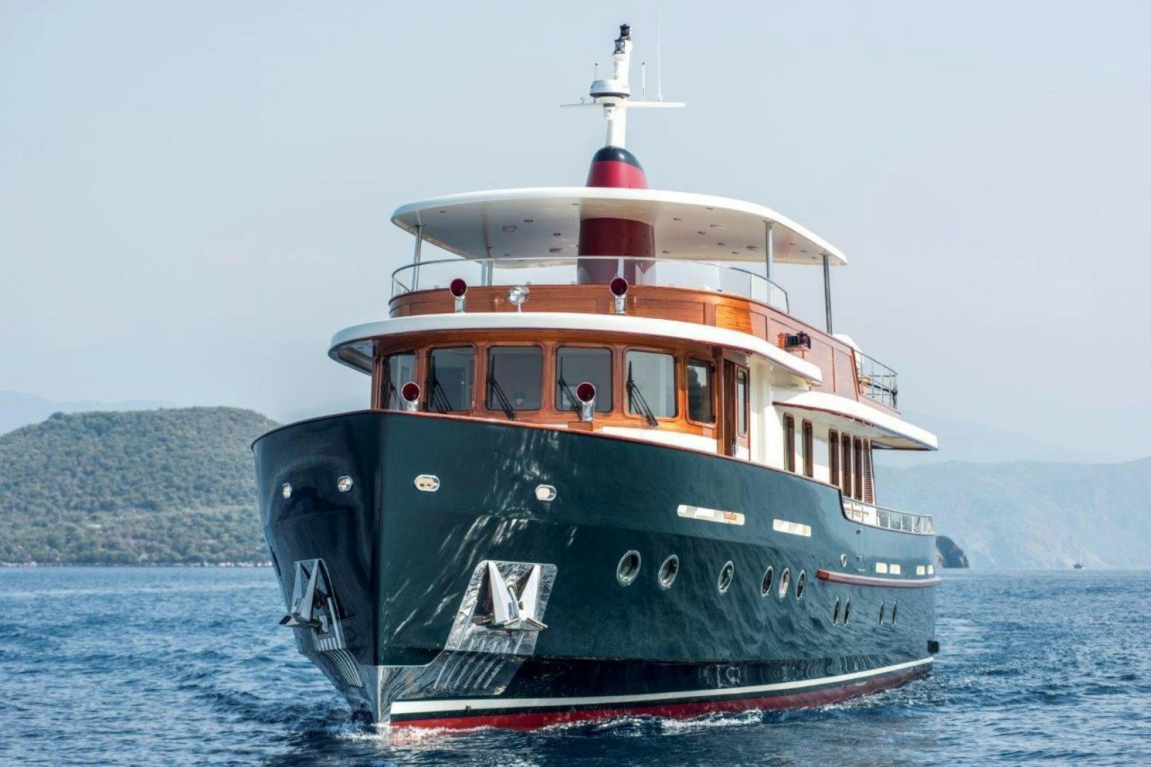 a boat in the water with Thomas Point Shoal Light in the background aboard MAGNOLIA ONE Yacht for Sale