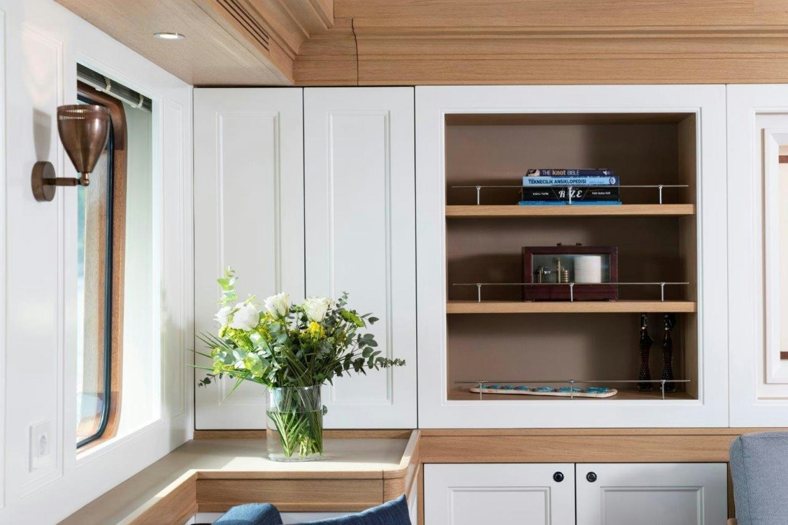 a vase of flowers on a table aboard MAGNOLIA ONE Yacht for Sale