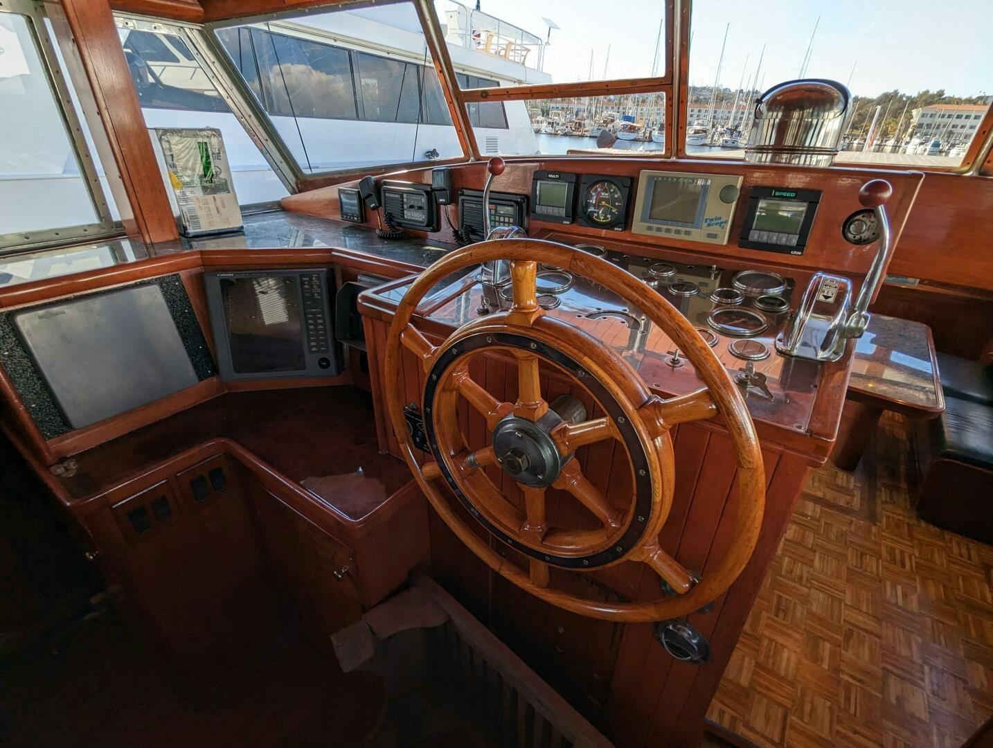 a wooden boat with a steering wheel aboard ISABELLA Yacht for Sale
