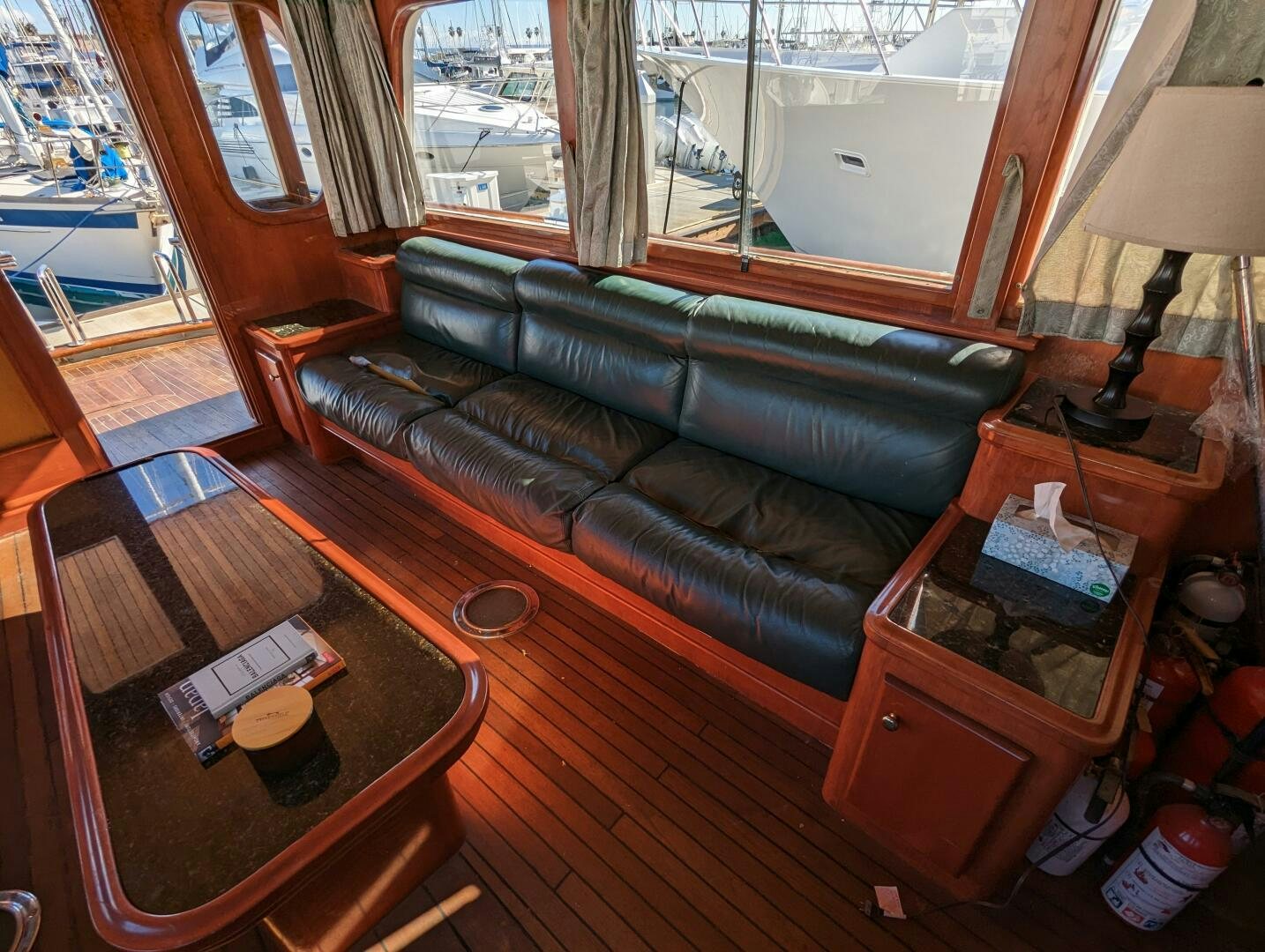 a living room with a leather couch aboard ISABELLA Yacht for Sale