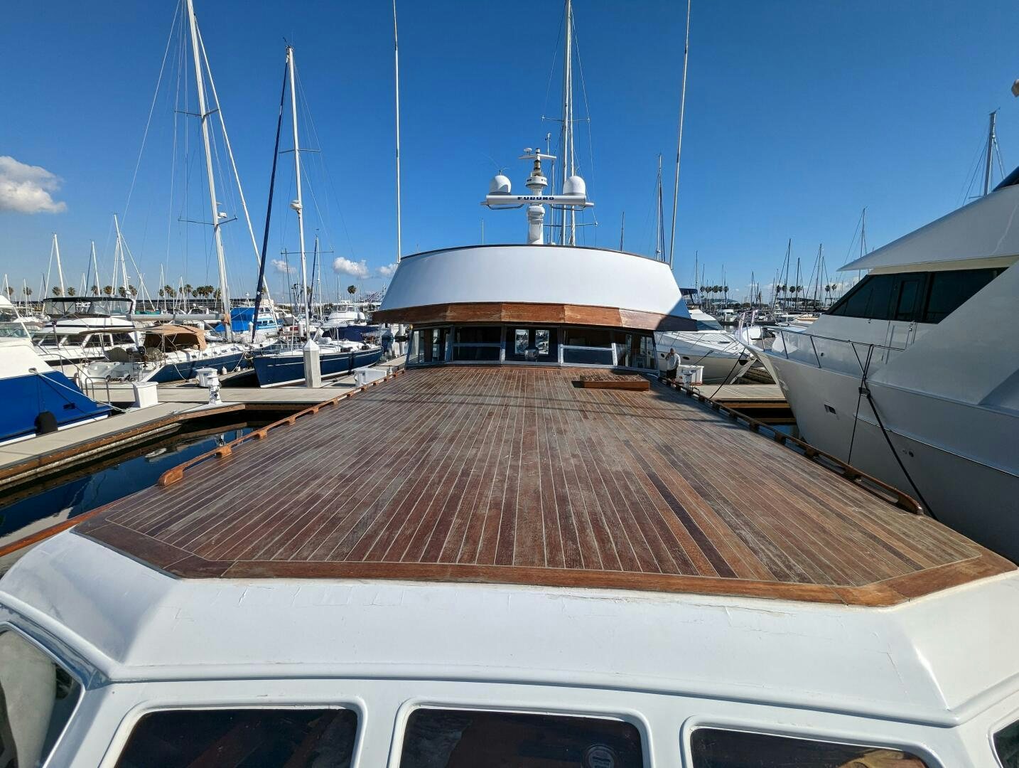a boat dock with many boats aboard ISABELLA Yacht for Sale