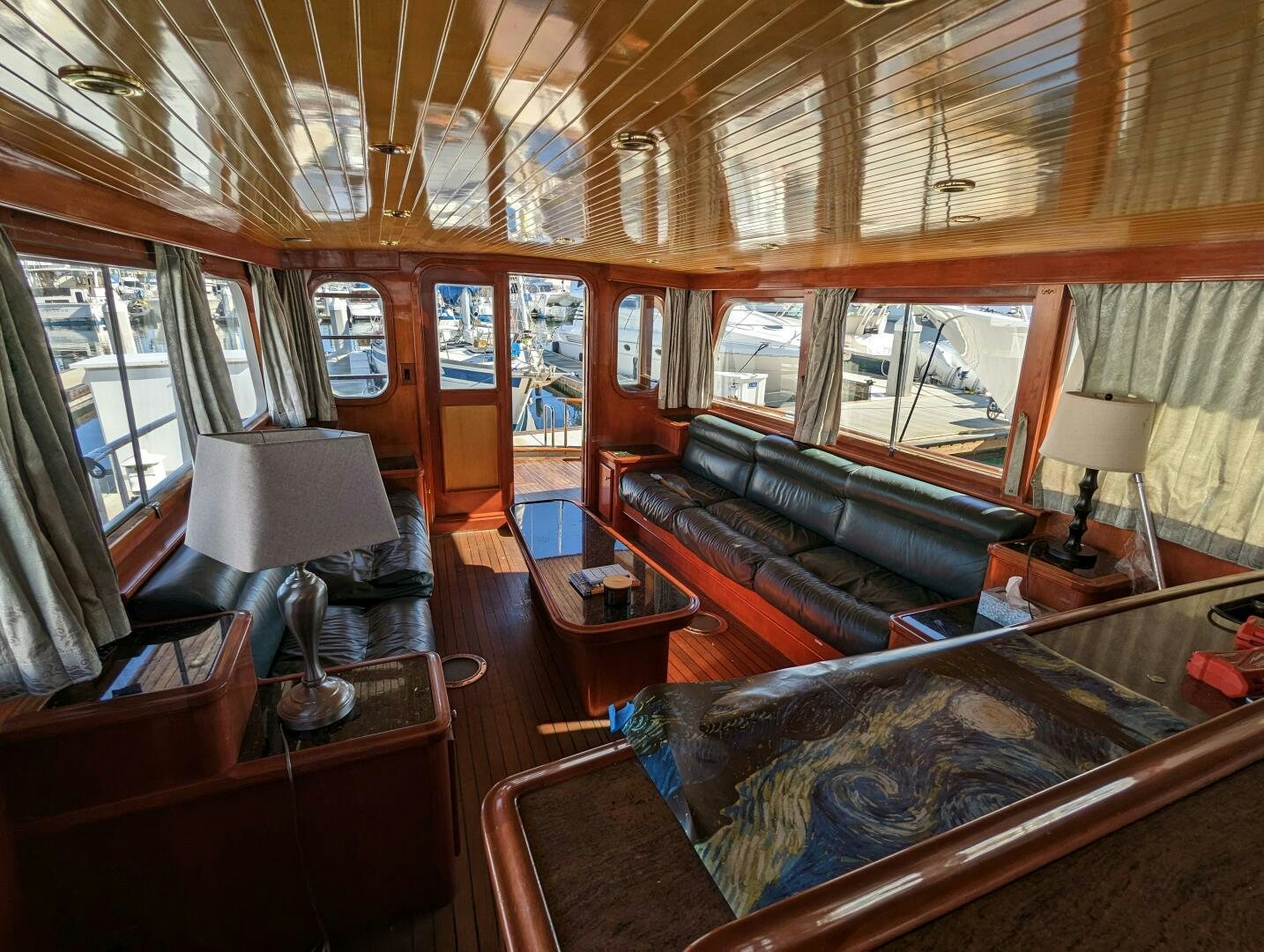 a living room with a large window aboard ISABELLA Yacht for Sale