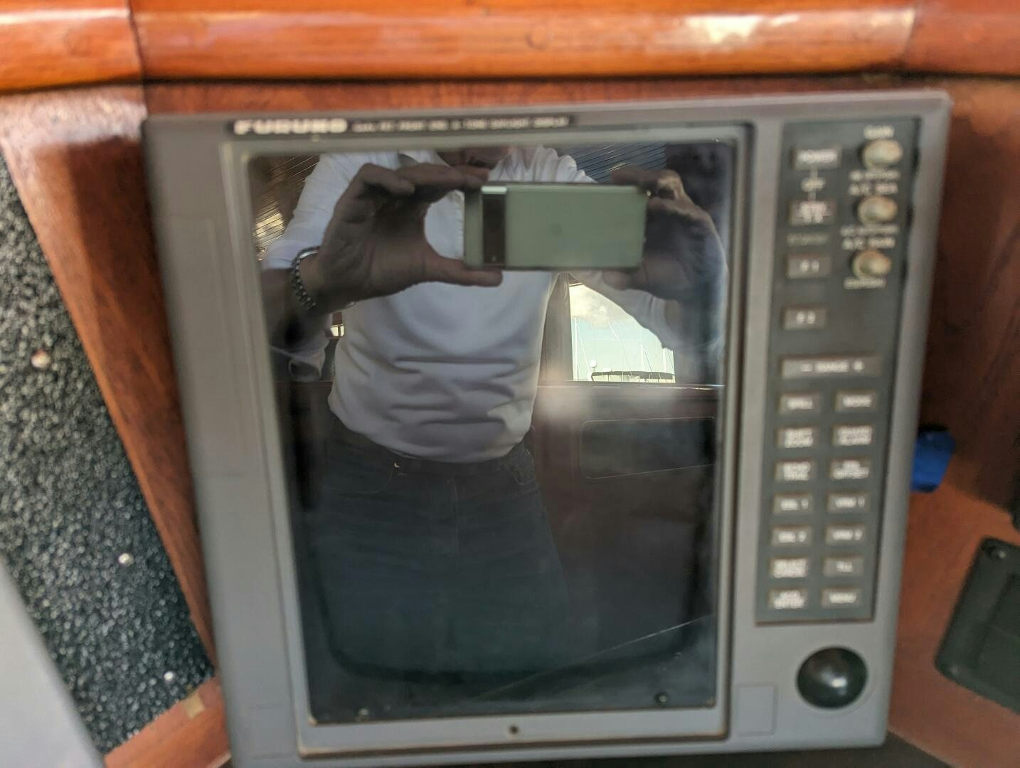 a person taking a selfie in a microwave aboard ISABELLA Yacht for Sale