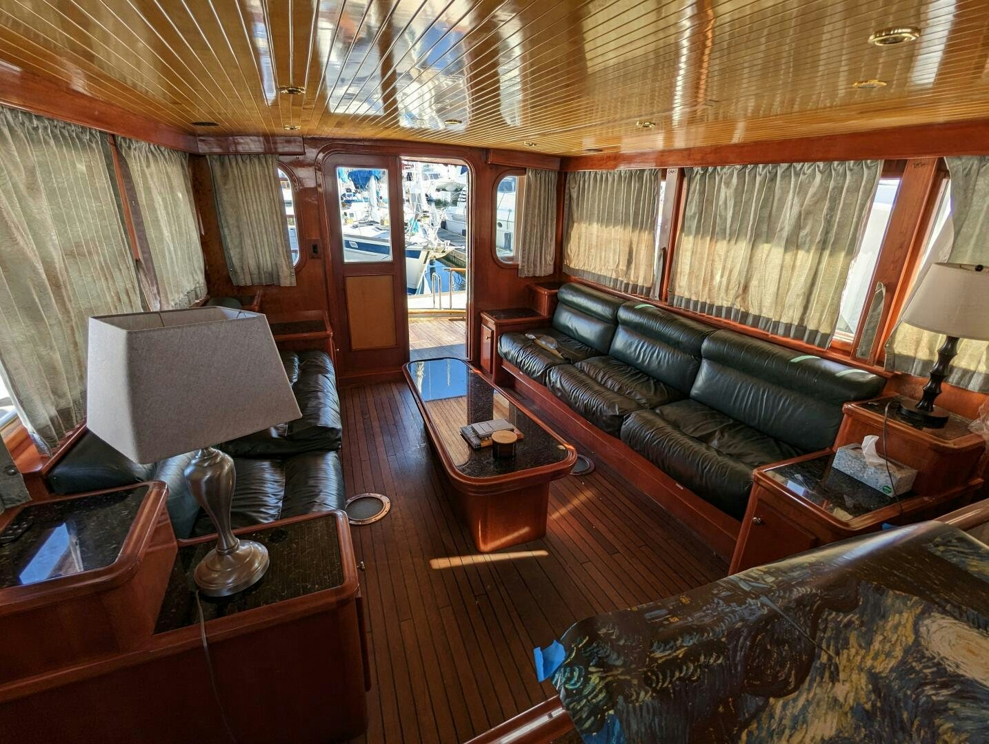 a living room with a leather couch aboard ISABELLA Yacht for Sale