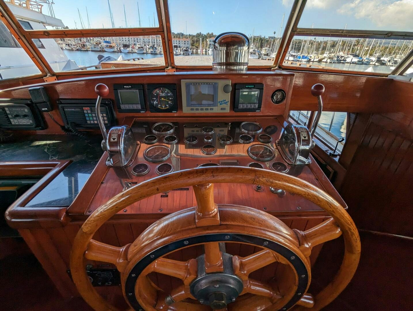 a wooden steering wheel aboard ISABELLA Yacht for Sale