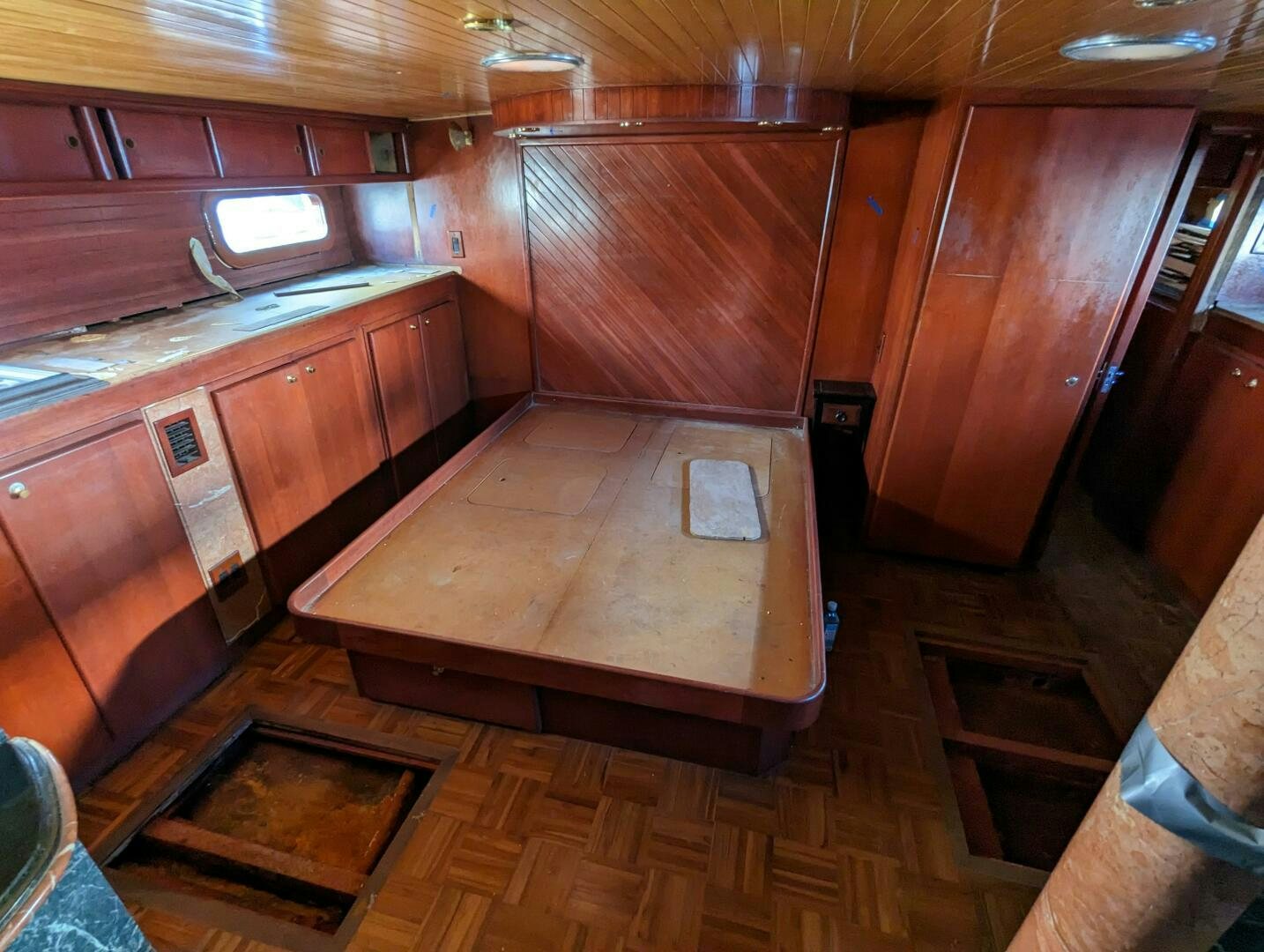 a kitchen with wooden cabinets aboard ISABELLA Yacht for Sale