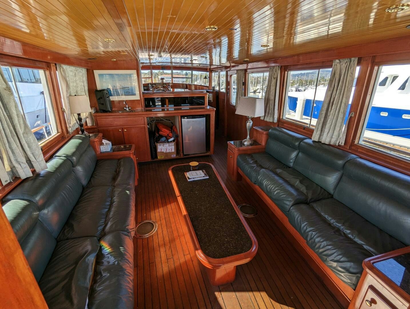 a living room with leather couches aboard ISABELLA Yacht for Sale