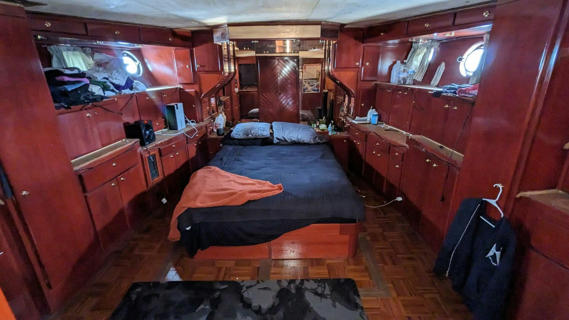 a room with a bed and a desk aboard ISABELLA Yacht for Sale