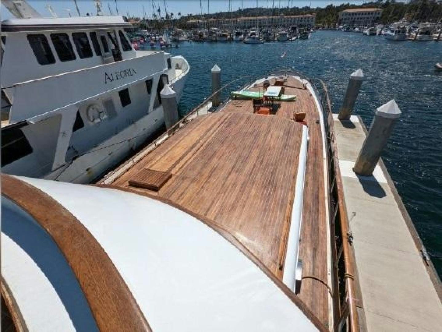 a boat is parked on the side of a river aboard ISABELLA Yacht for Sale