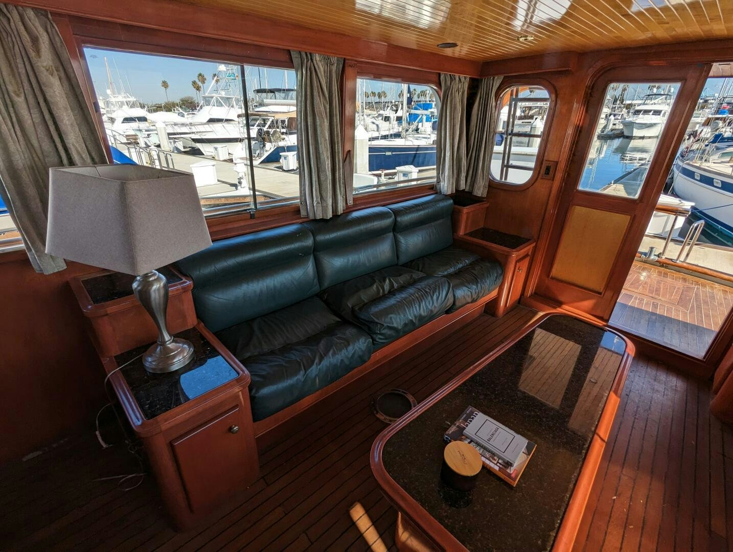 a living room with a leather couch aboard ISABELLA Yacht for Sale