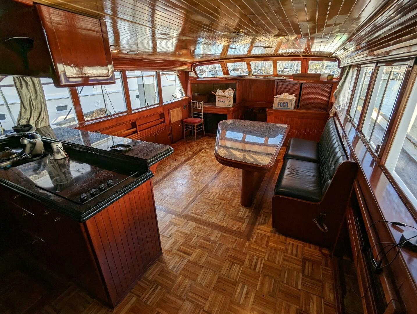 a room with a table and chairs aboard ISABELLA Yacht for Sale