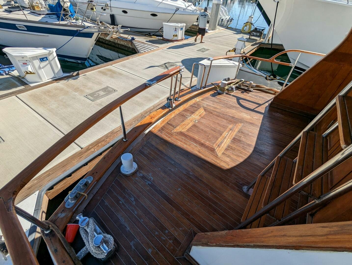 a wooden deck with a boat on it aboard ISABELLA Yacht for Sale
