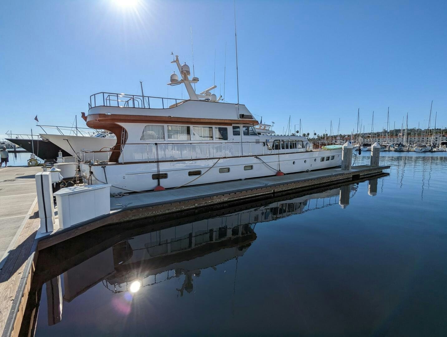 a large white boat in a harbor aboard ISABELLA Yacht for Sale