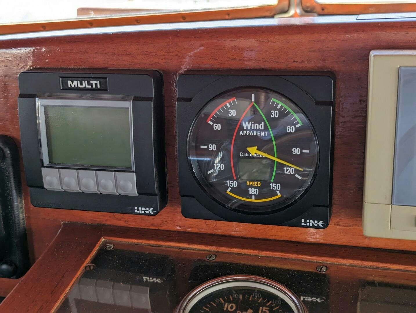 a clock on a wooden table aboard ISABELLA Yacht for Sale