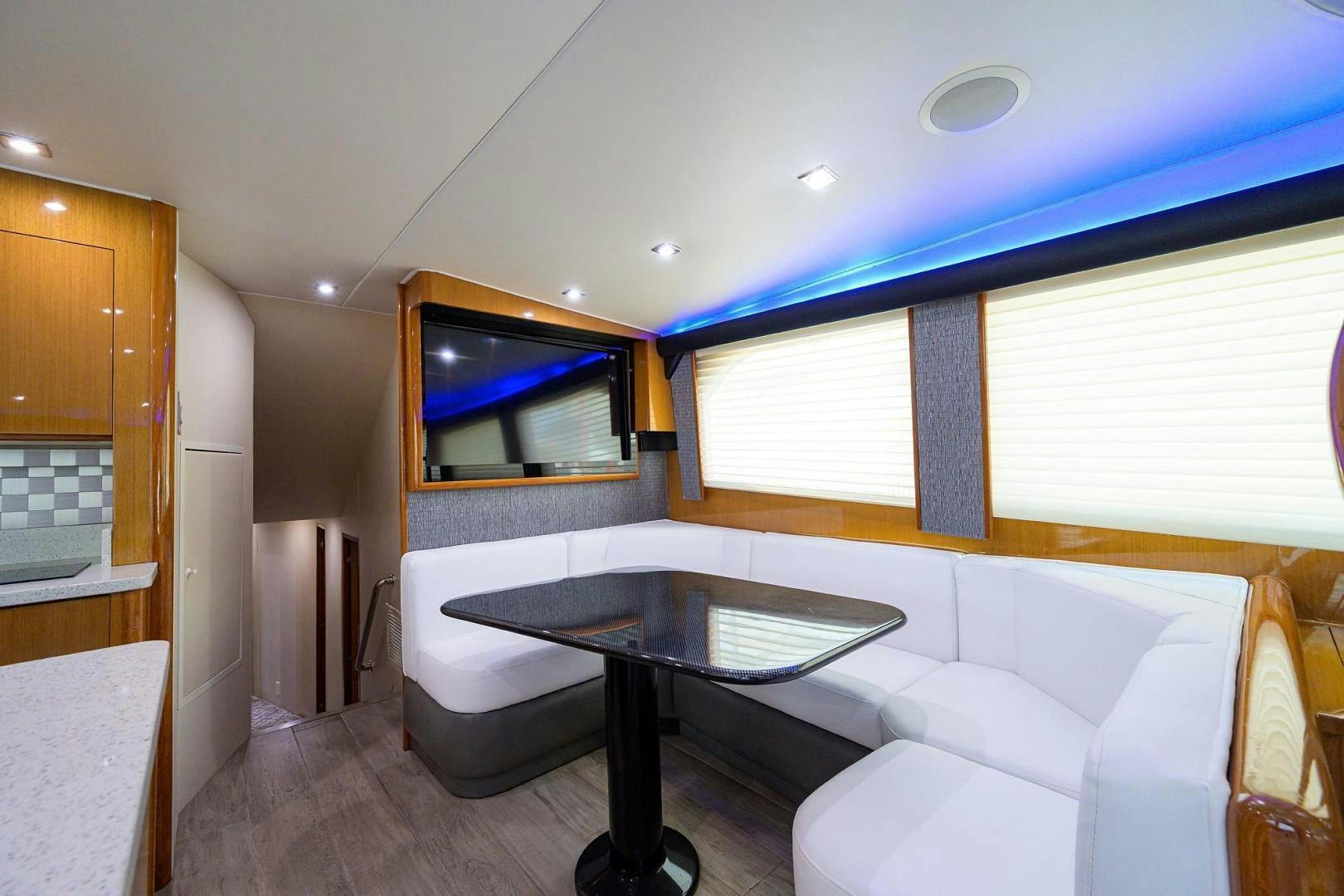 a room with a table and couch aboard VAGRANT Yacht for Sale