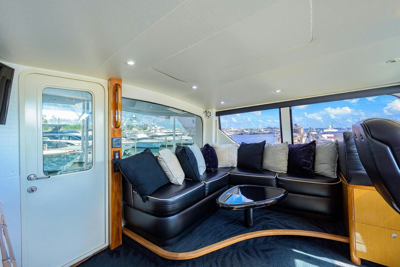 a living room with a couch and a table aboard VAGRANT Yacht for Sale