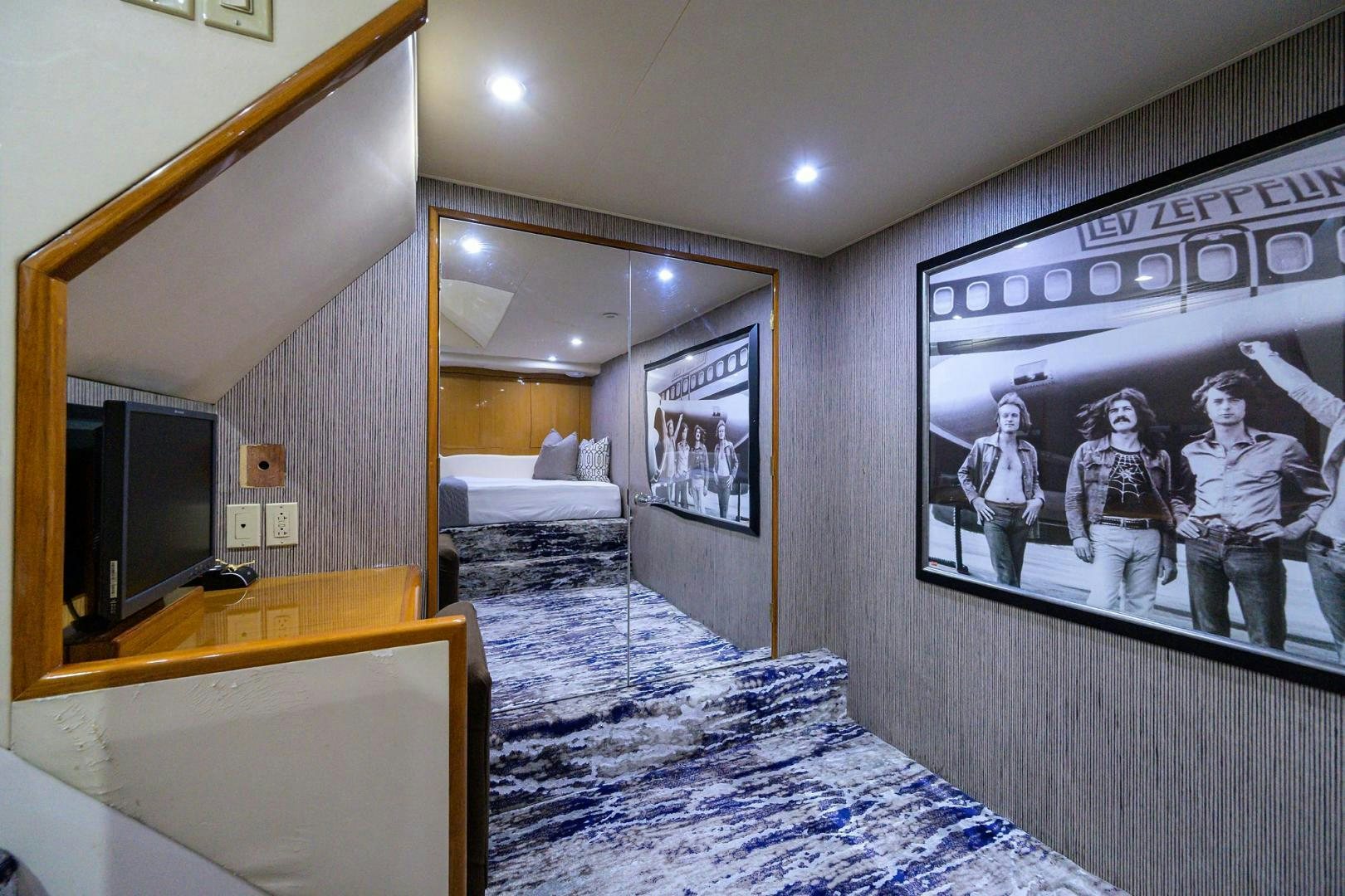 a room with a mirror and a bed aboard VAGRANT Yacht for Sale