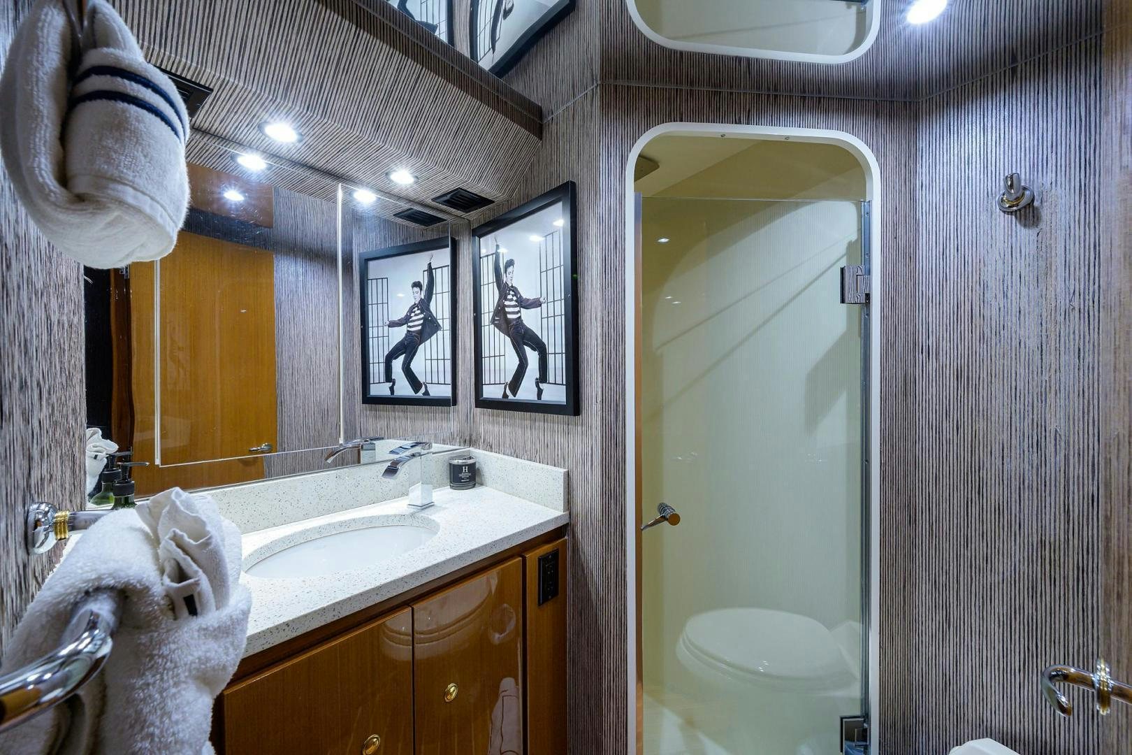 a bathroom with a sink and a mirror aboard VAGRANT Yacht for Sale
