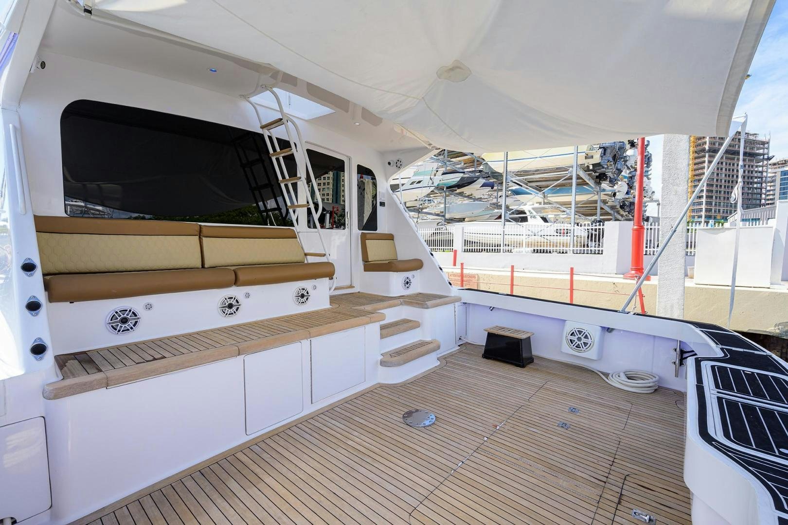 a room with a large white and wood floor and a large window aboard VAGRANT Yacht for Sale