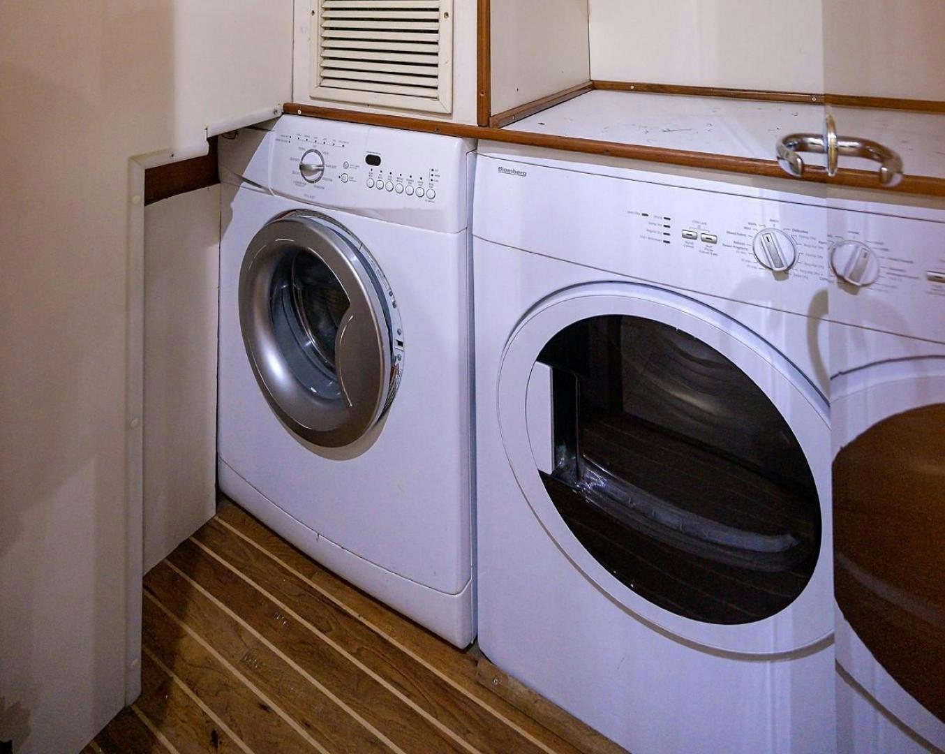 a washing machine in a room aboard VAGRANT Yacht for Sale