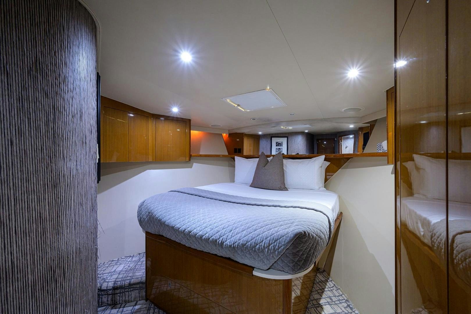 a room with a bed and a mirror aboard VAGRANT Yacht for Sale