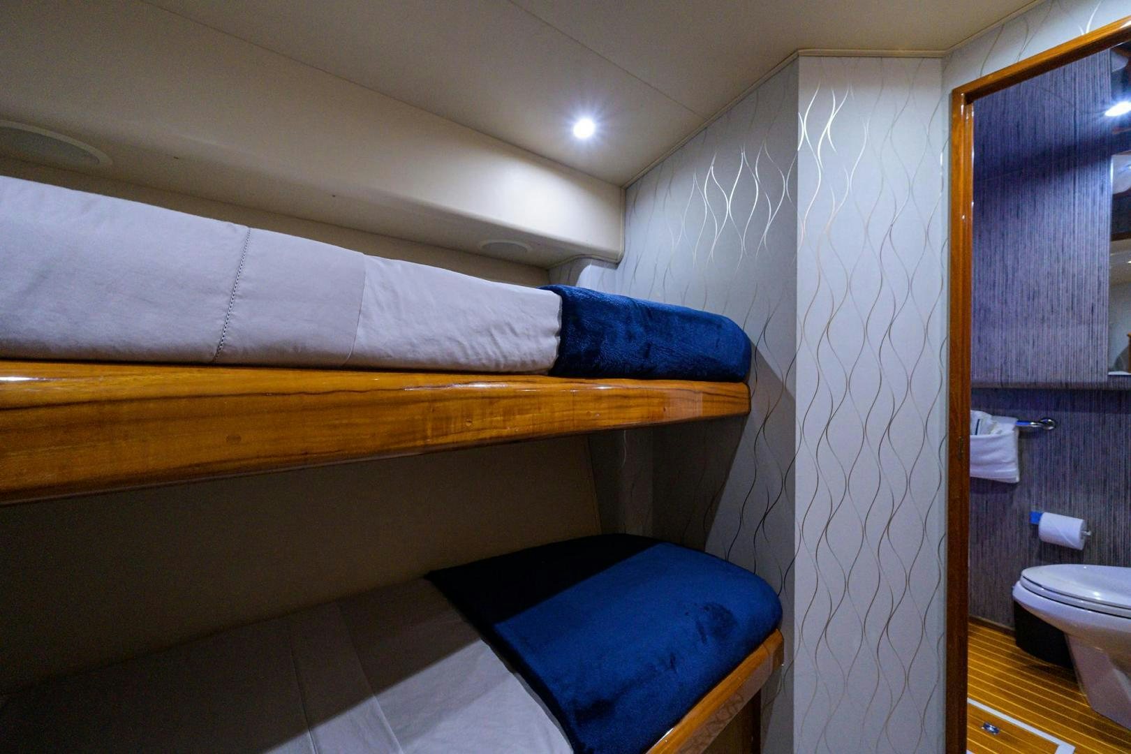 a room with a bed and a shower aboard VAGRANT Yacht for Sale