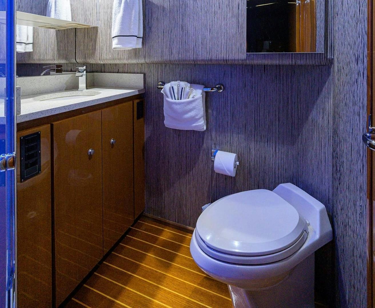 a bathroom with a toilet and sink aboard VAGRANT Yacht for Sale