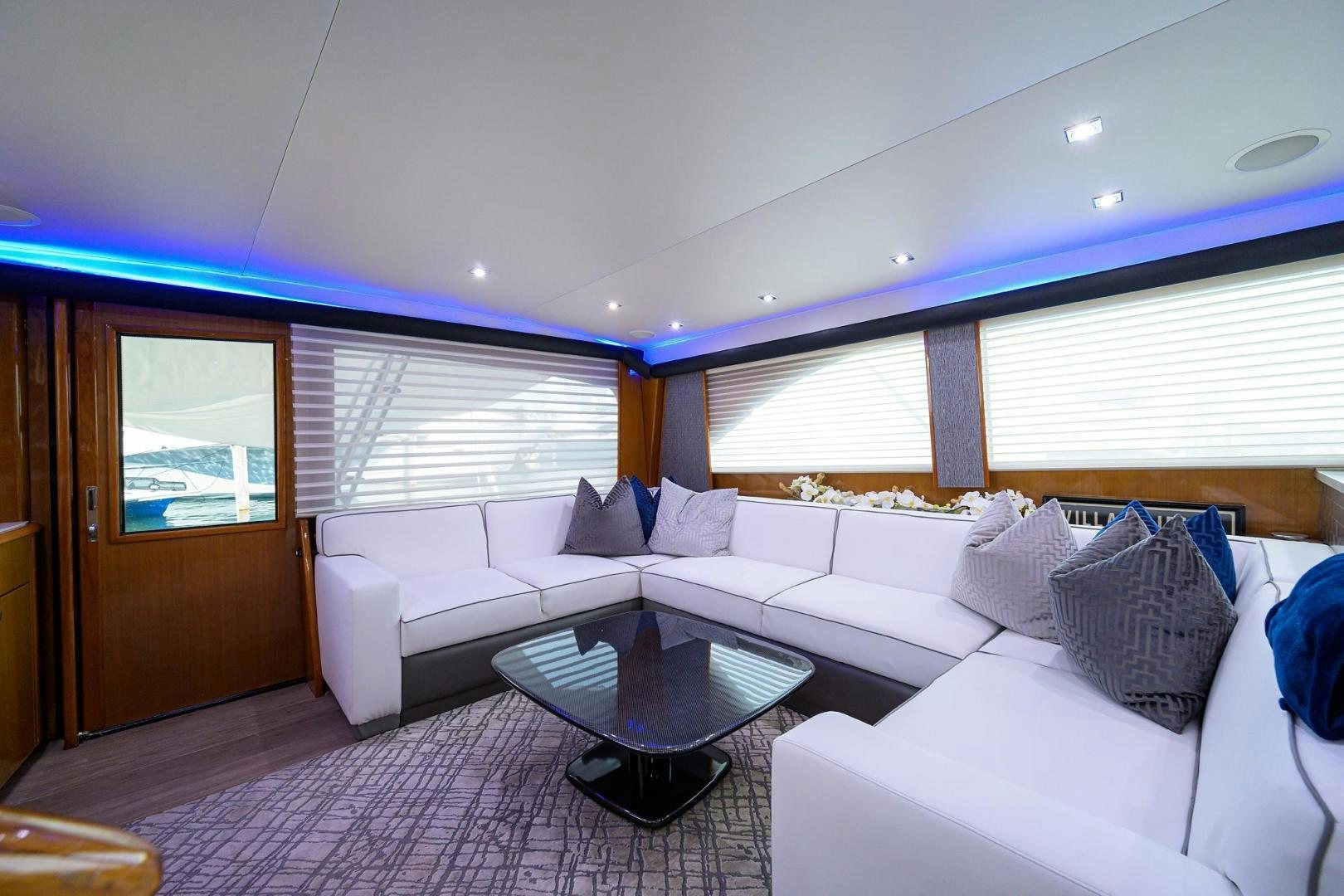 a room with a couch and a table aboard VAGRANT Yacht for Sale