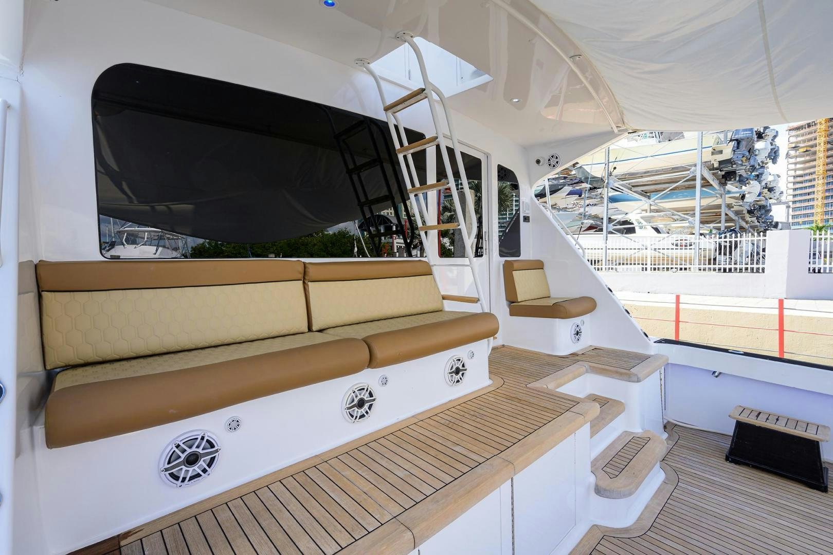 a room with a large window and a large white bed aboard VAGRANT Yacht for Sale