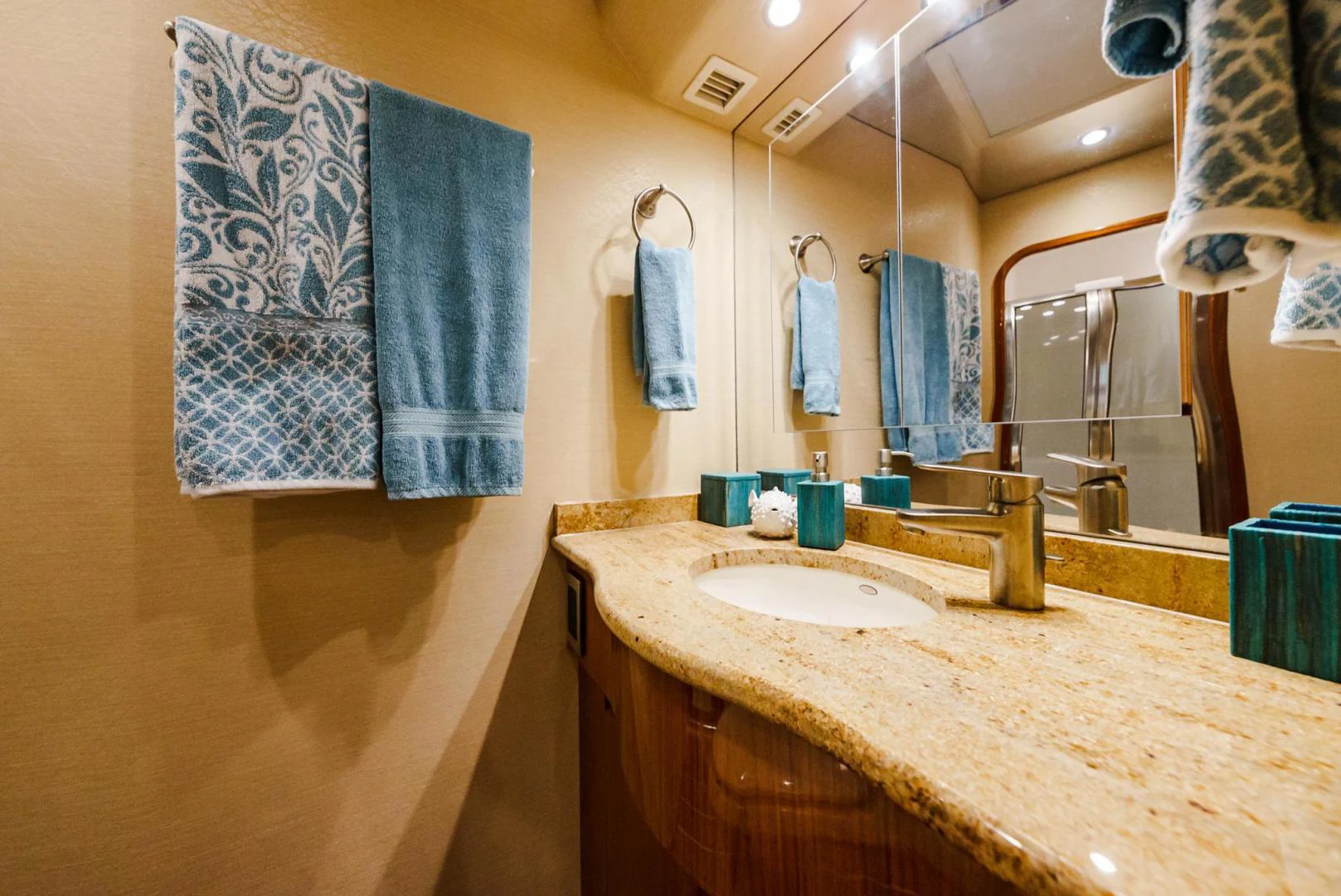 a bathroom with a sink and towels aboard PANACEA Yacht for Sale