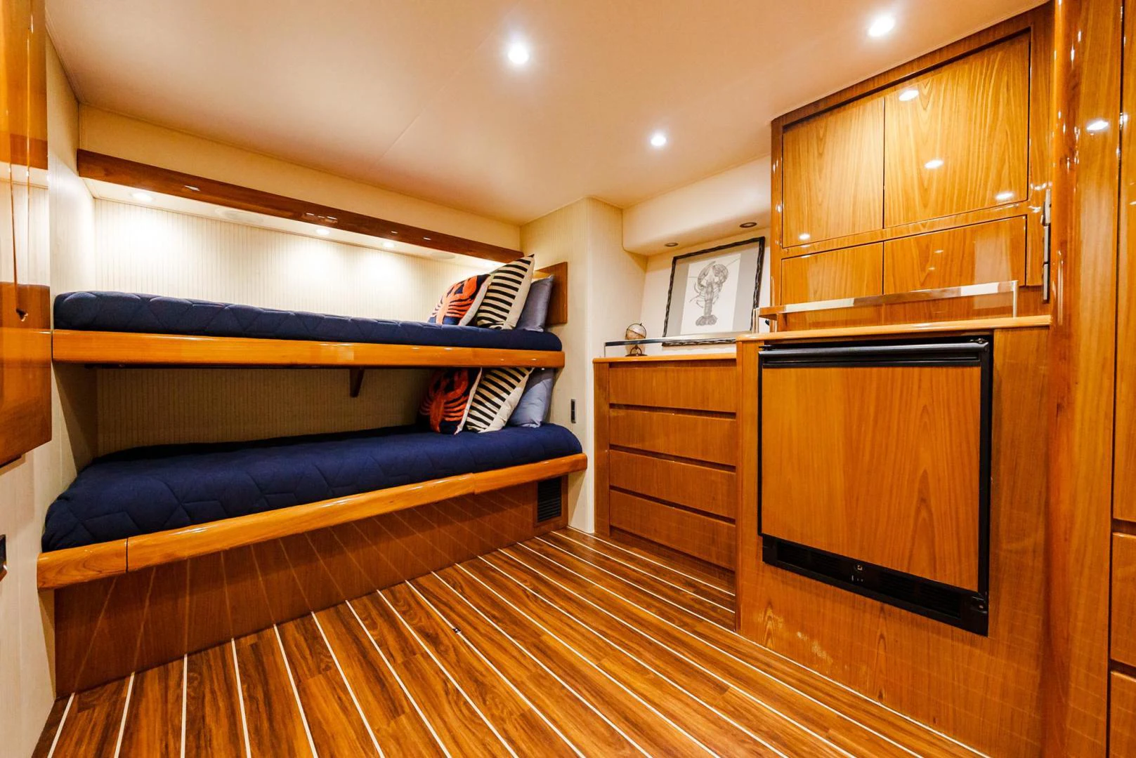 a bedroom with a bed and a dresser aboard PANACEA Yacht for Sale