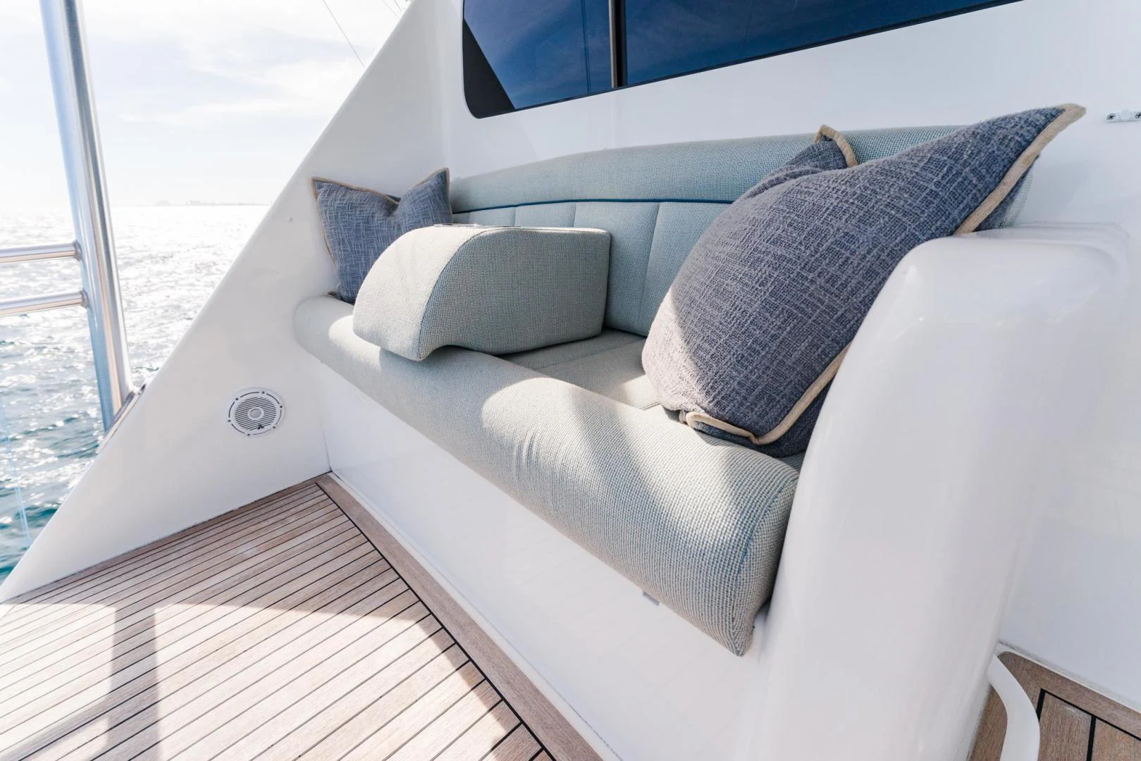 a white couch with pillows on it aboard PANACEA Yacht for Sale