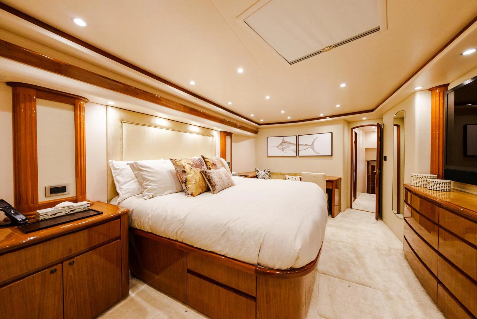a bedroom with a bed and a mirror aboard PANACEA Yacht for Sale