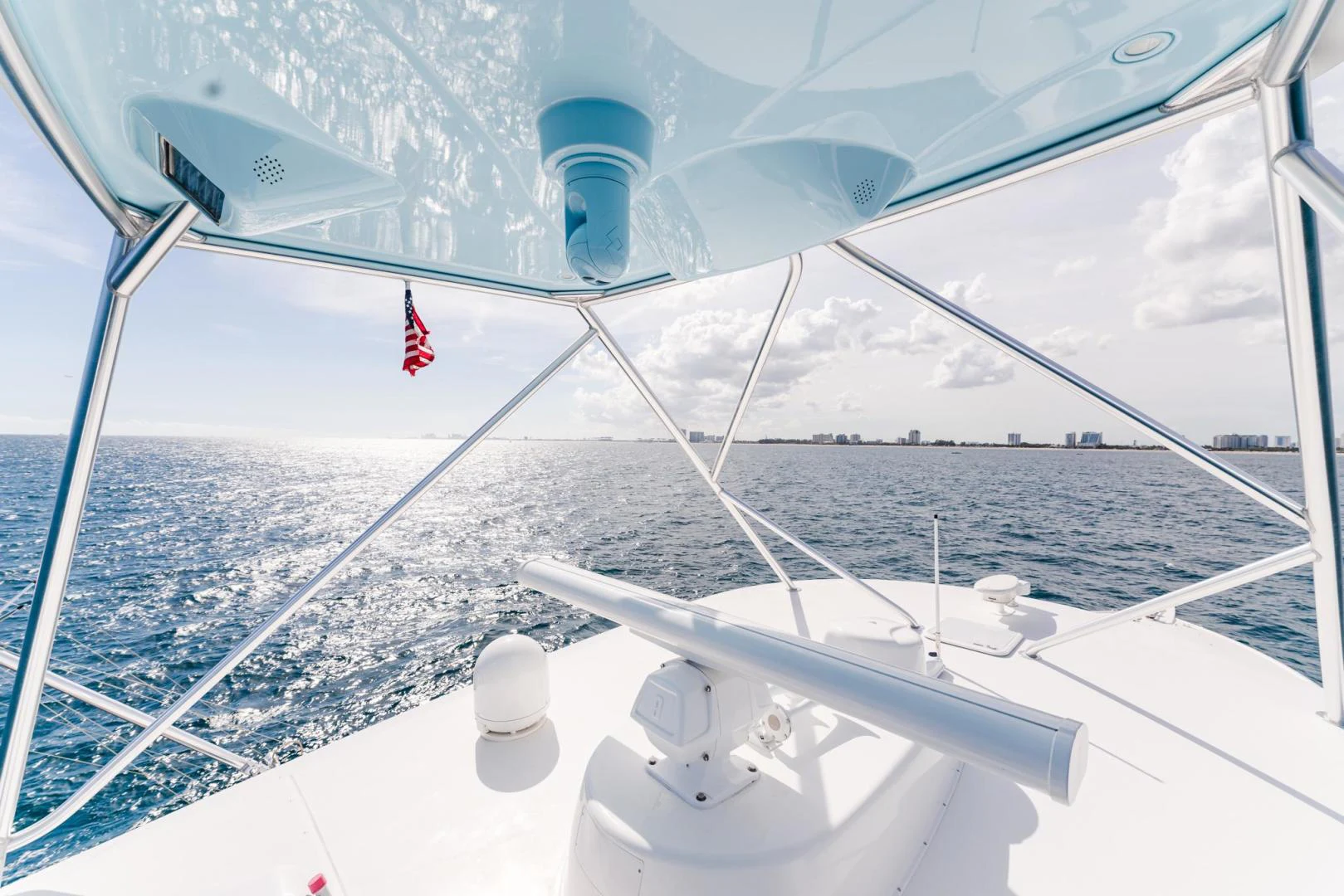 a boat with a flag on the front aboard PANACEA Yacht for Sale