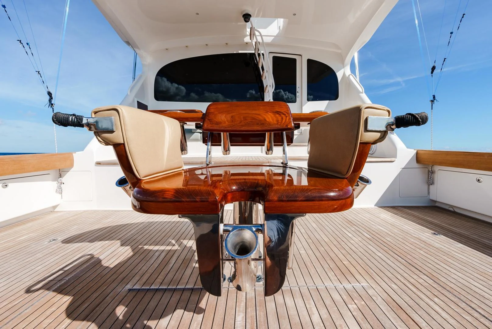 a white and orange boat on a wooden dock aboard PANACEA Yacht for Sale