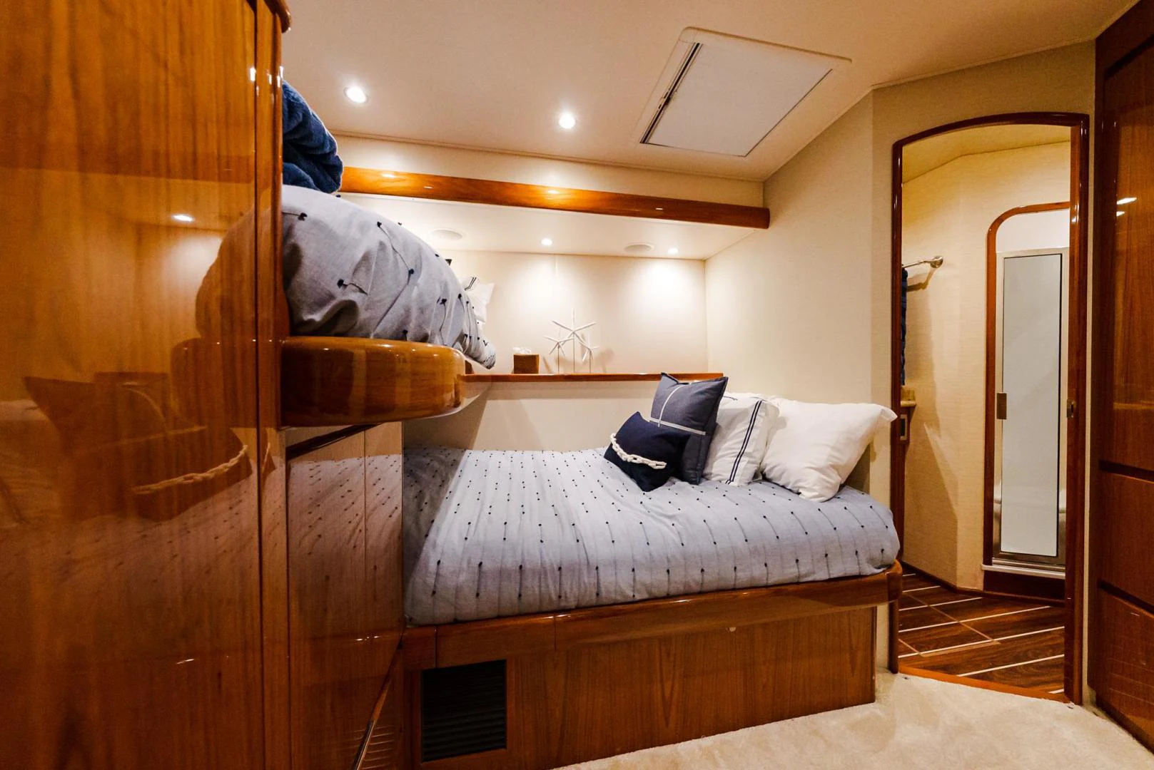 a bedroom with a bed and a closet aboard PANACEA Yacht for Sale