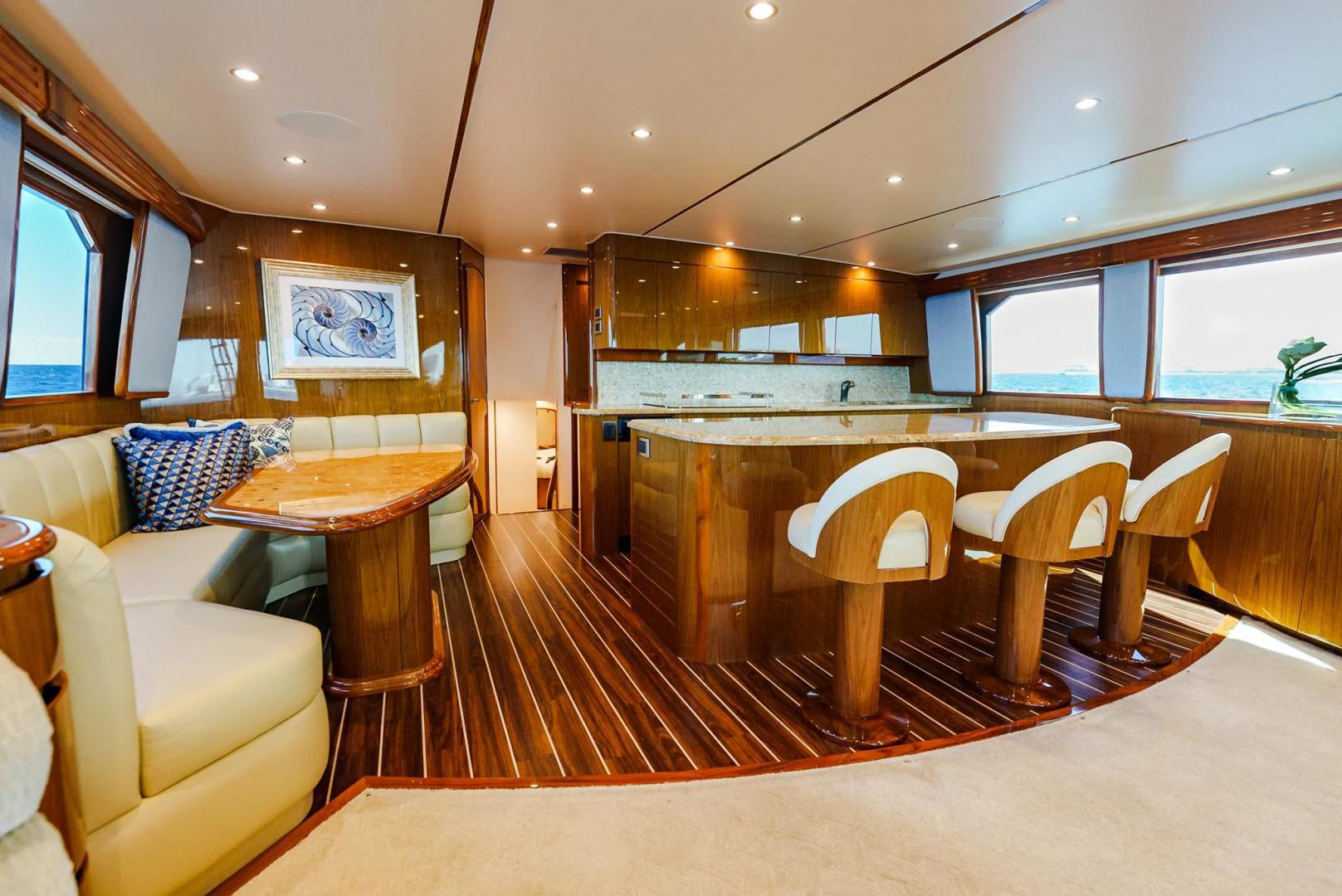 a large kitchen with a table and chairs aboard PANACEA Yacht for Sale