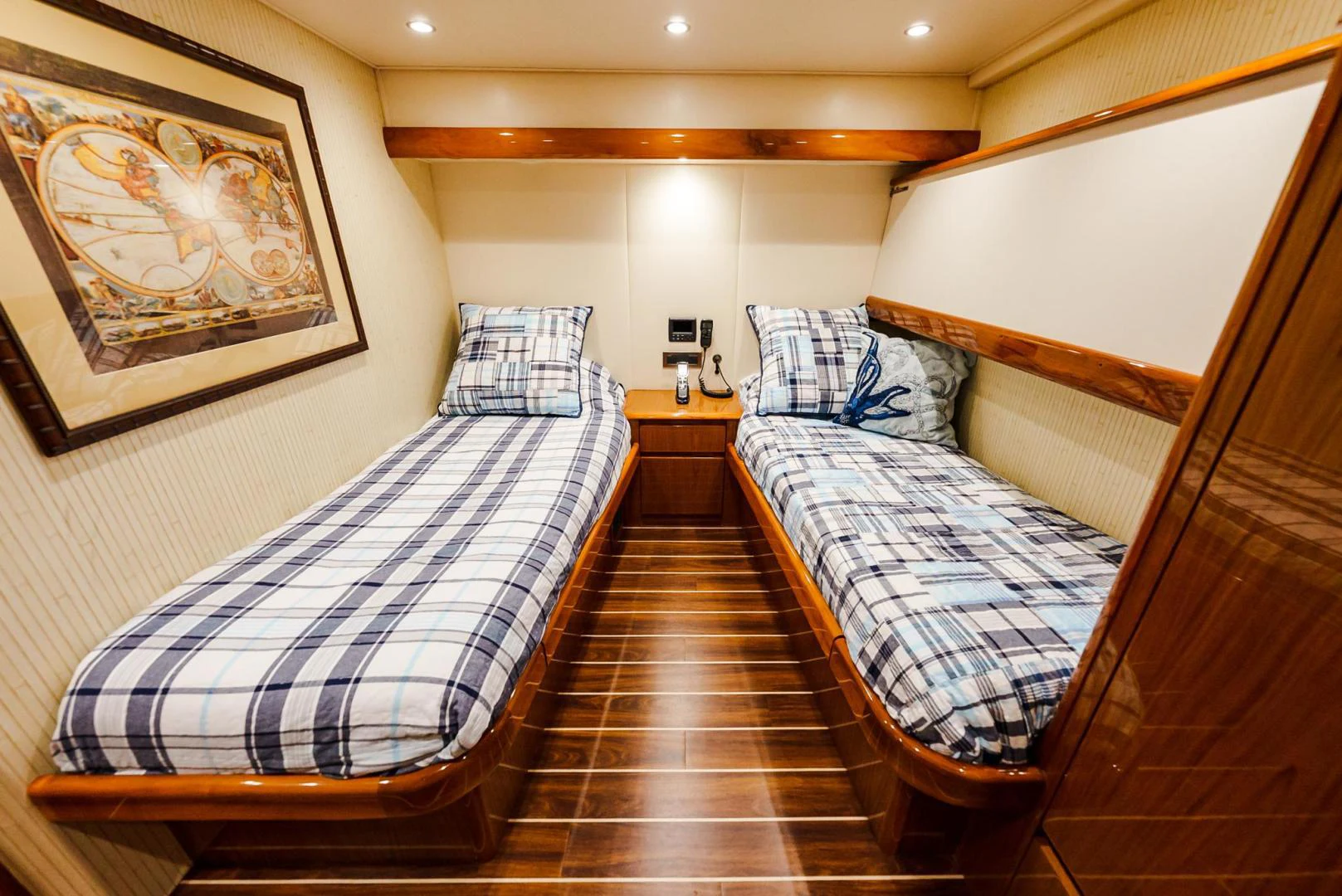 a room with a bed and a wood door aboard PANACEA Yacht for Sale