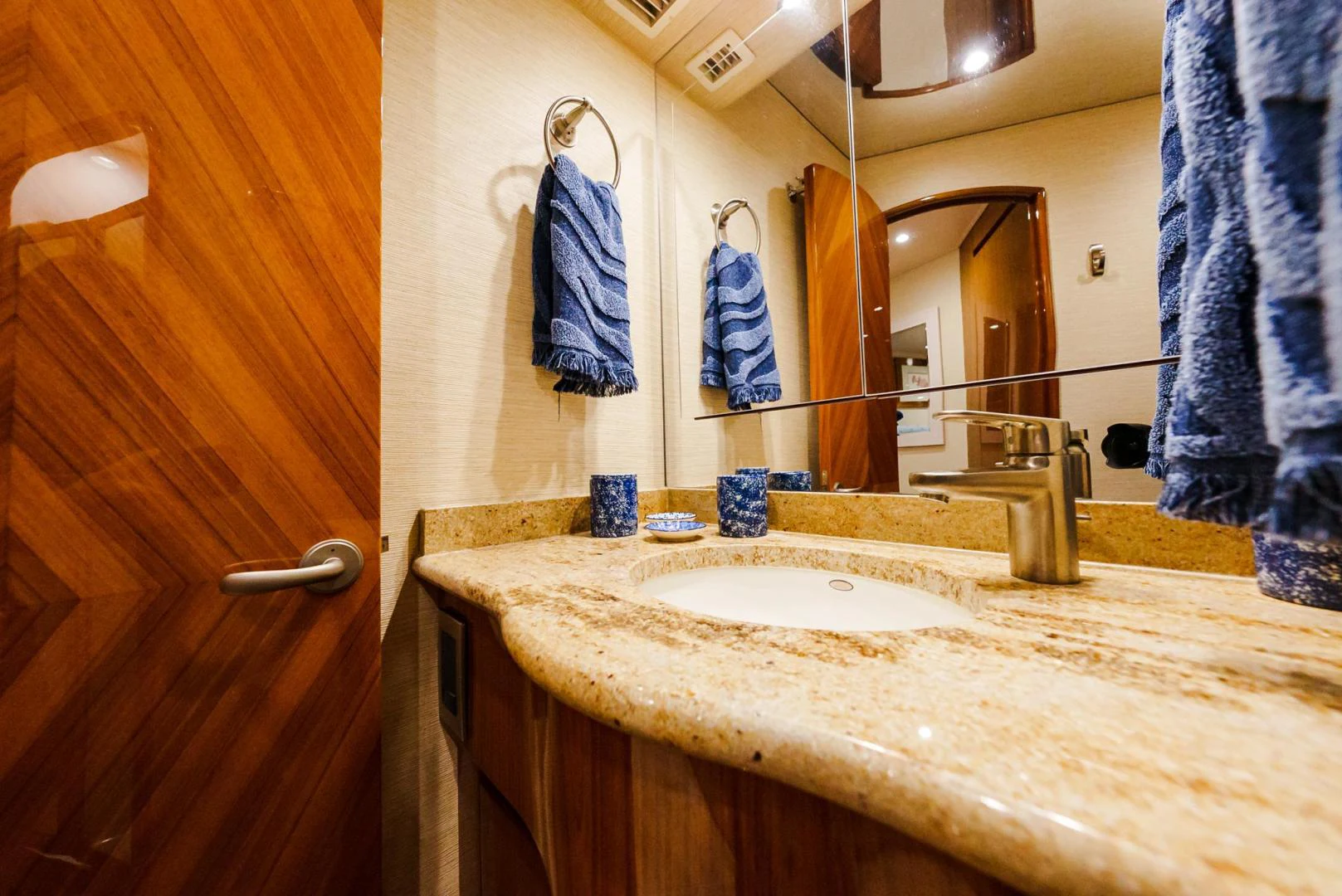 a bathroom with a sink and mirror aboard PANACEA Yacht for Sale