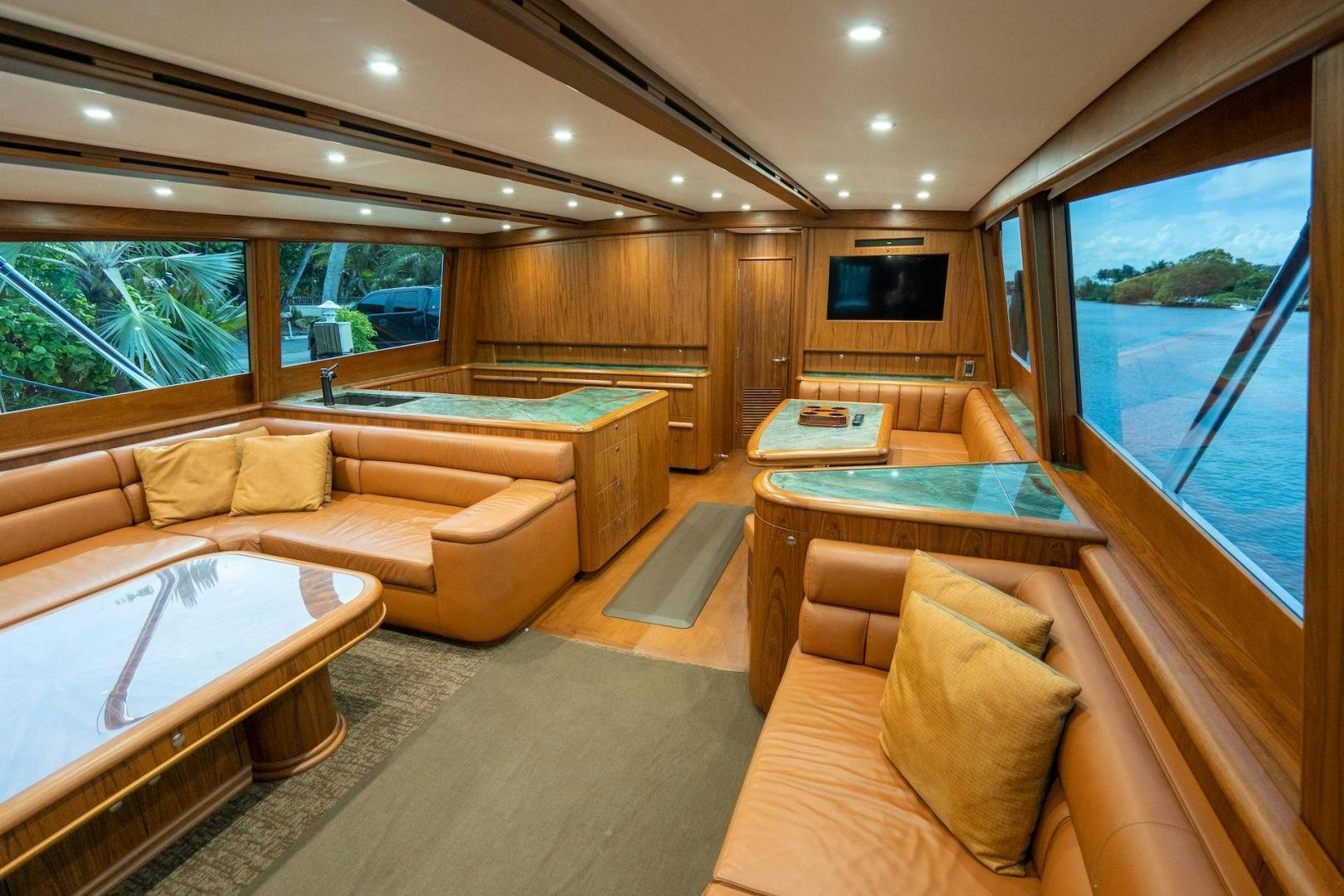 a living room with a large window aboard TANGAROA Yacht for Sale